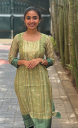 Chanderi pista green color kurti set paired with gold leggings