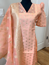 Kanakambaram color kurti set paired with gold leggings