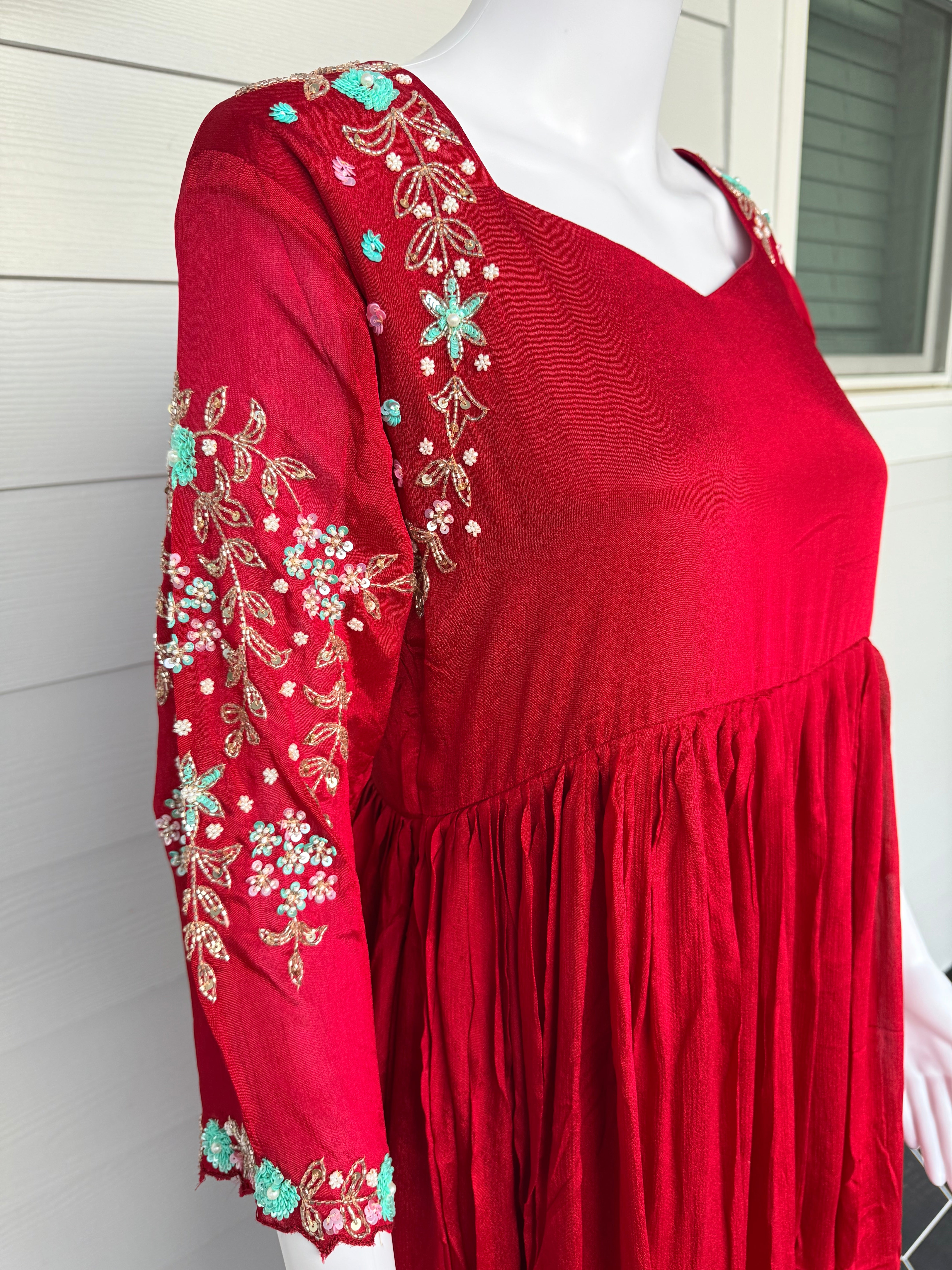 Red chinnon dress with hand work on hands