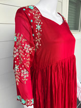 Red chinnon dress with hand work on hands