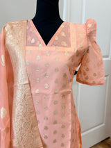 Kanakambaram color kurti set paired with gold leggings