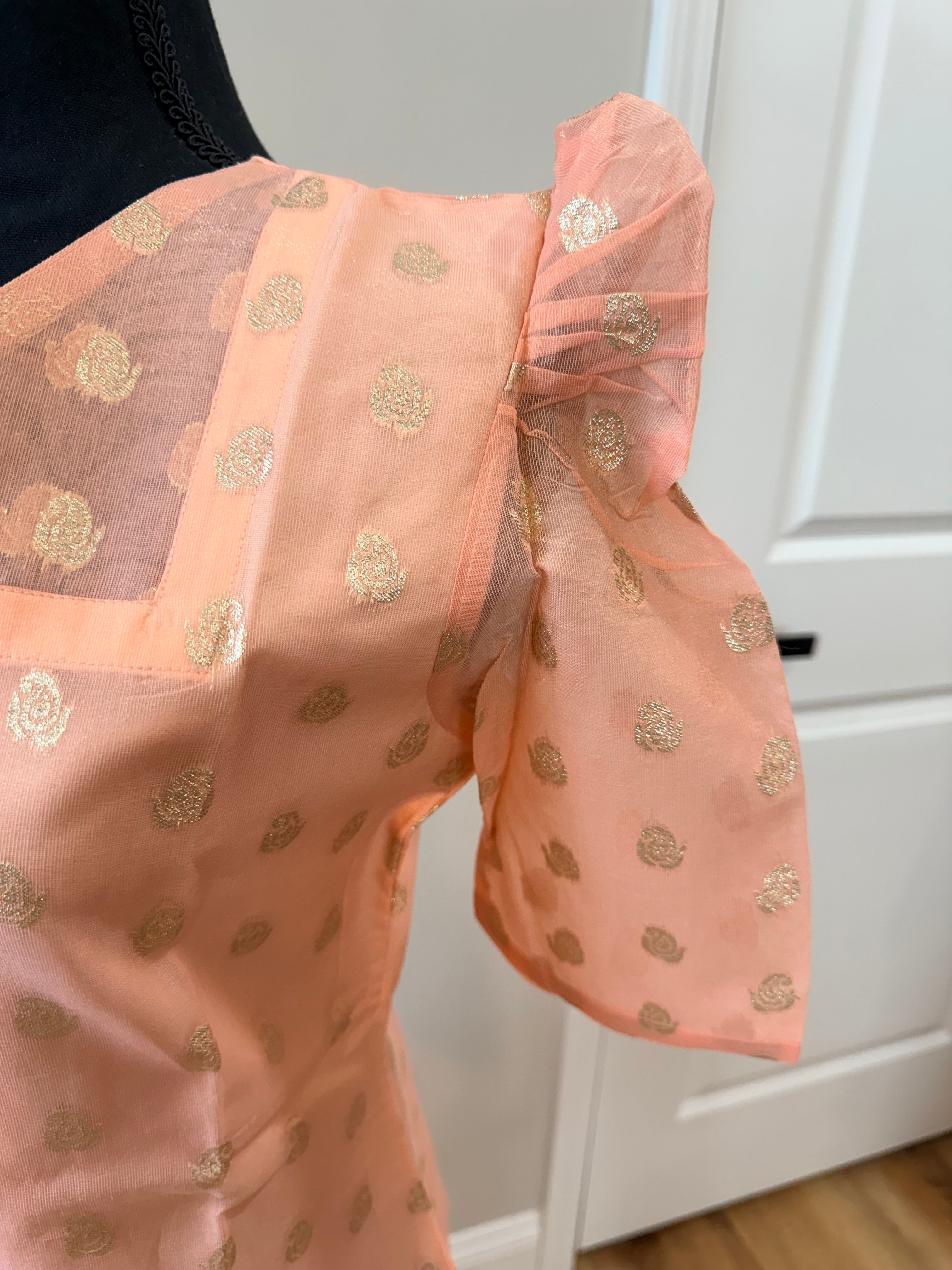Kanakambaram color kurti set paired with gold leggings