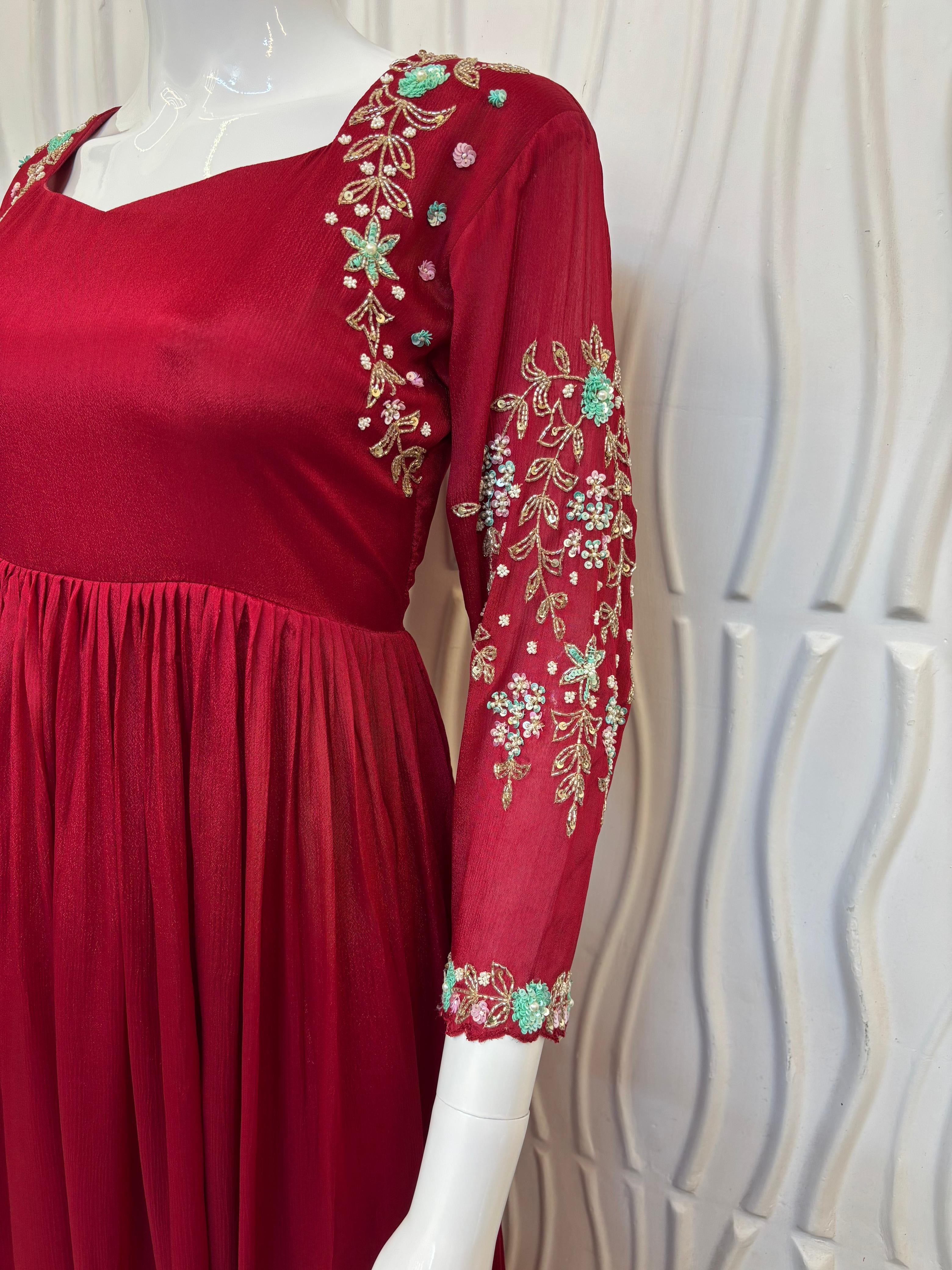 Red chinnon dress with hand work on hands