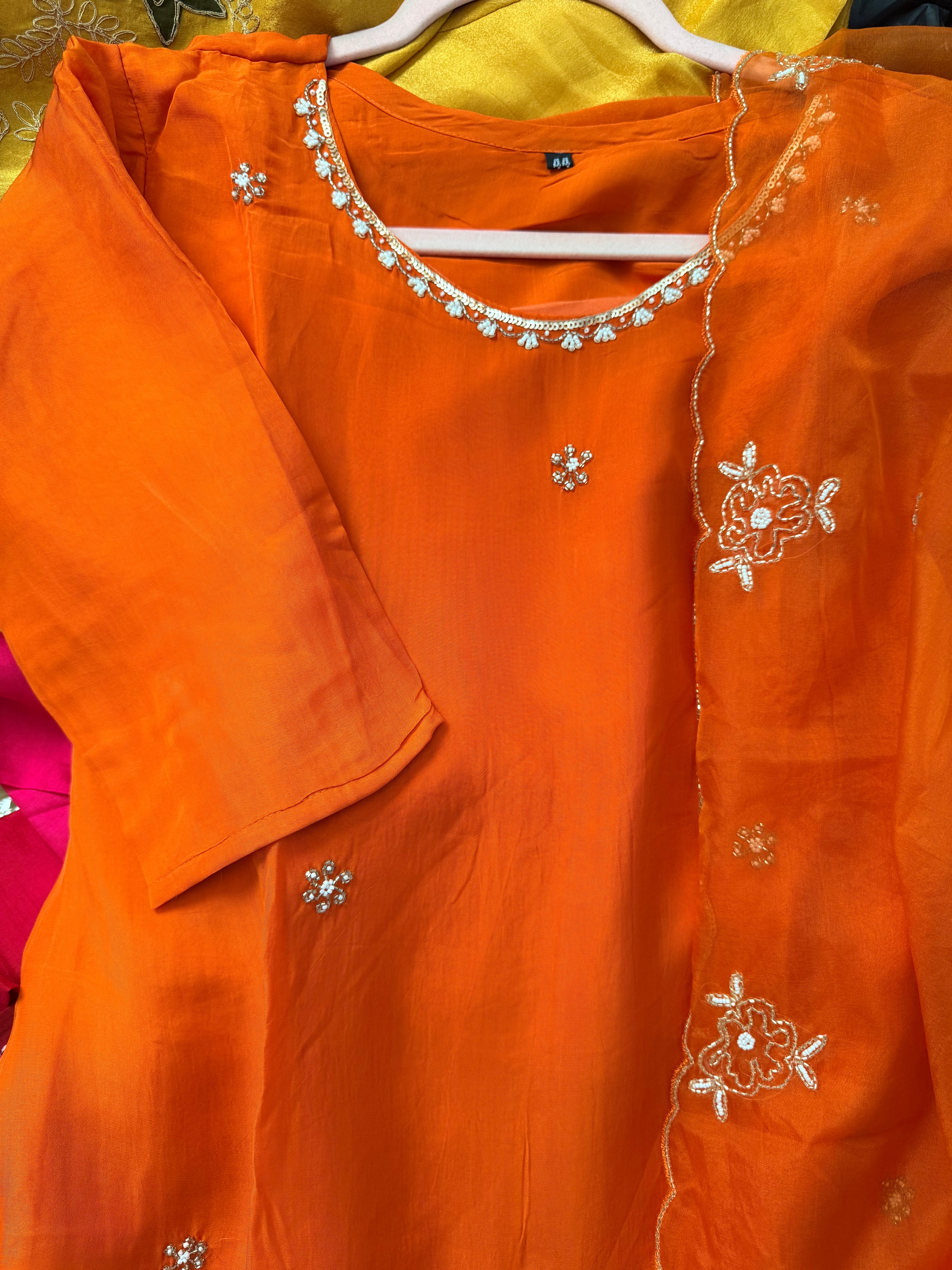 Orange organza set with hand work