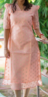 Kanakambaram color kurti set paired with gold leggings